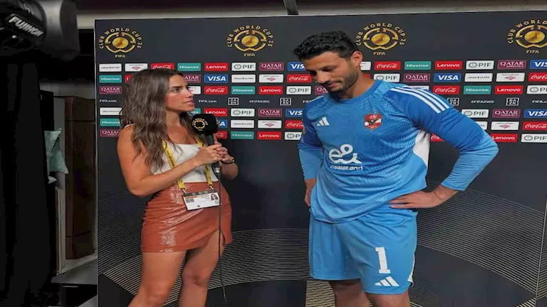 الشناوي يتجنب النظر للمذيعة
